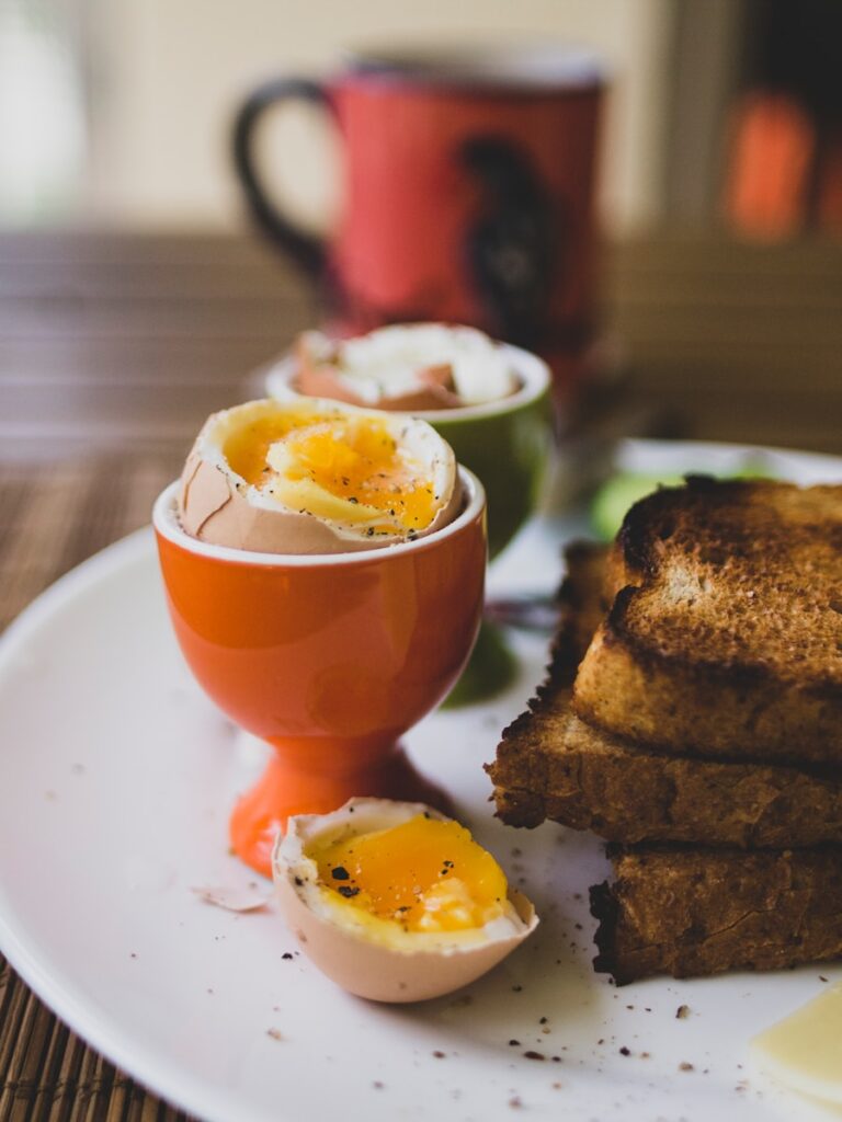 a white plate topped with eggs and toast