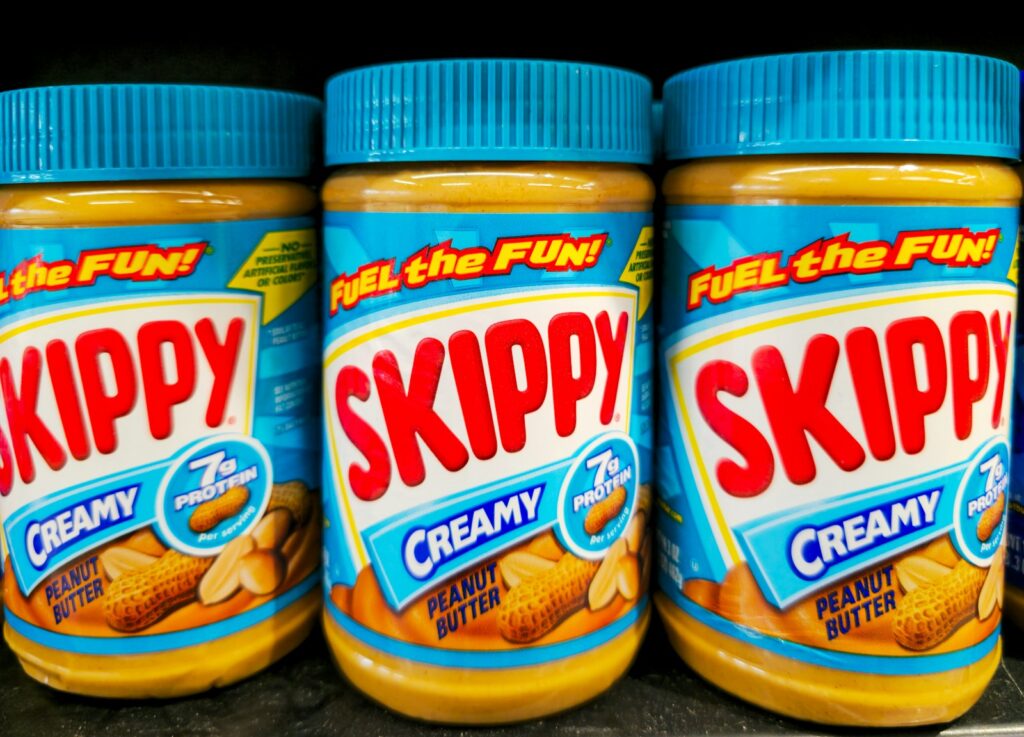Three jars of skippy creamy peanut butter