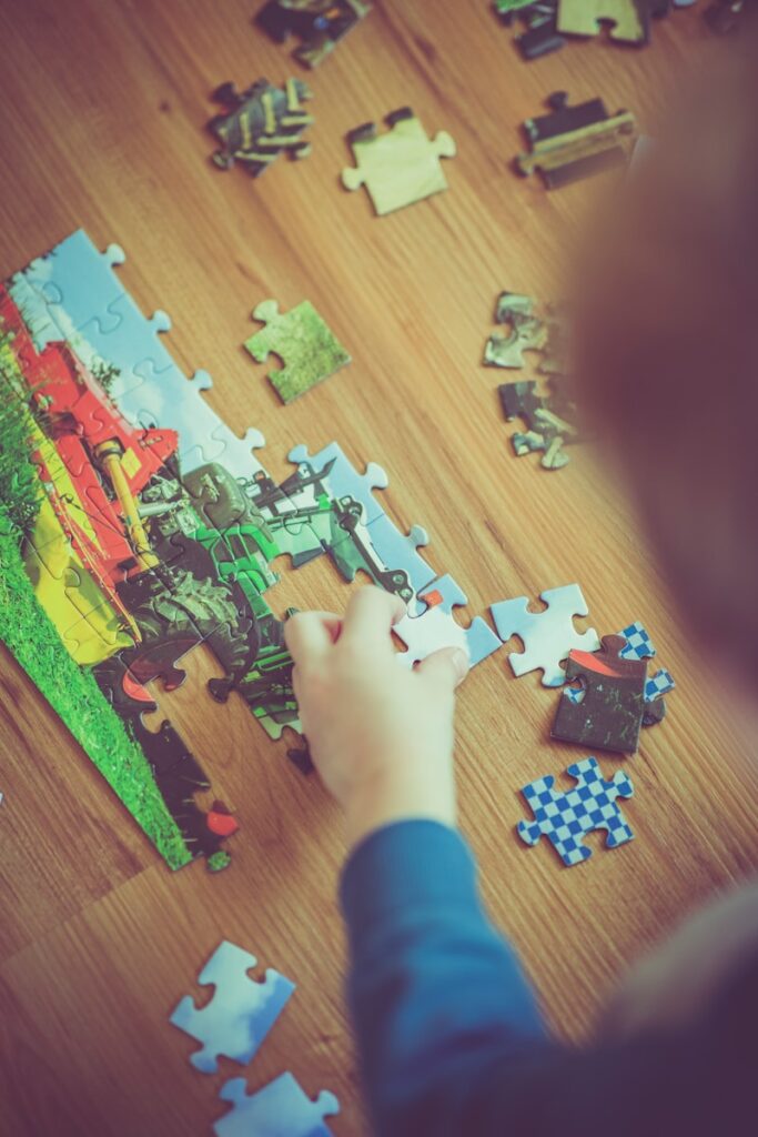 boy playing puzzle